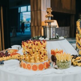 Beautiful buffet decoration with different fruits and with a chocolate fountain