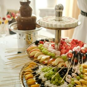 Fondue with a chocolate fountain and sweets for it.Sweet theme