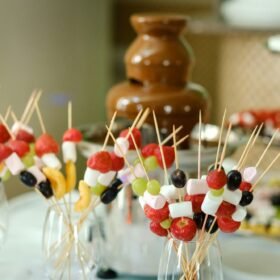 Fondue with a chocolate fountain and sweets for it.Sweet theme