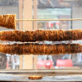 Turkish Street Food Kokorec rolls made with lamb bowel roasting in wood fired oven.